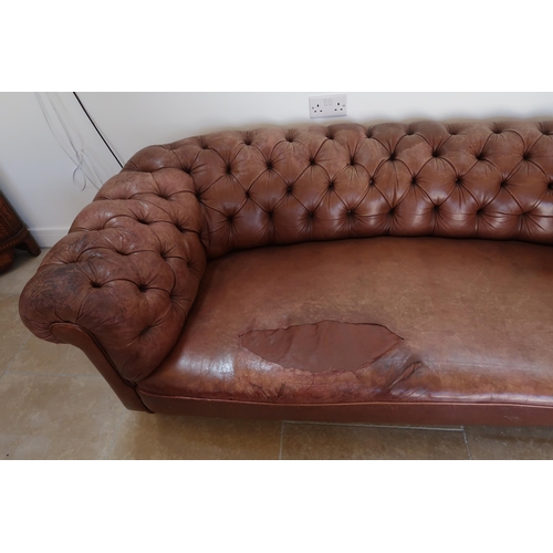 640 - A 19th century Howard style country house large button back Chesterfield settee with a nice faded pa... 