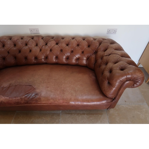 640 - A 19th century Howard style country house large button back Chesterfield settee with a nice faded pa... 