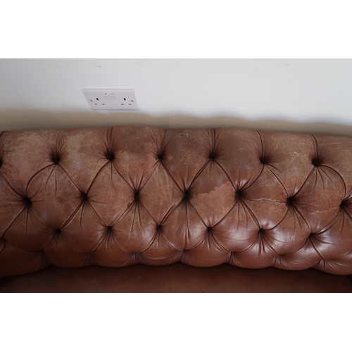 640 - A 19th century Howard style country house large button back Chesterfield settee with a nice faded pa... 