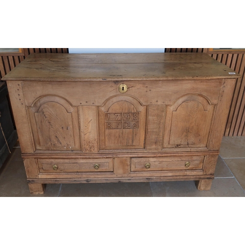 649 - An 18th century oak mule chest, the front carved with the date 1728 RP. 120cm wide x 79cm high x 53c... 