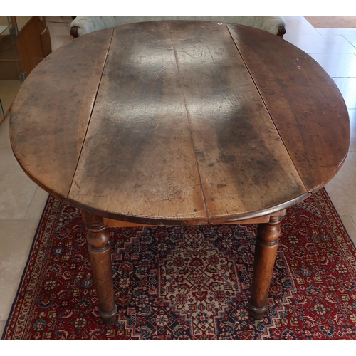 650 - A 19th century continental hardwood wake table on turned legs, 181cm long x 130cm wide