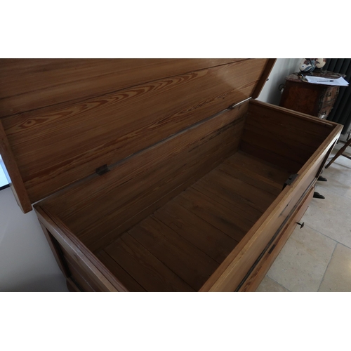 651 - A large pine continental storage box with a lift up lid above a long drawer, 158cm wide x 85cm high ... 