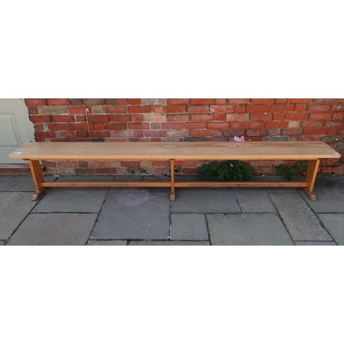 660 - A Oak bench removed from the Leys school dining hall 280cm long x 48cm high