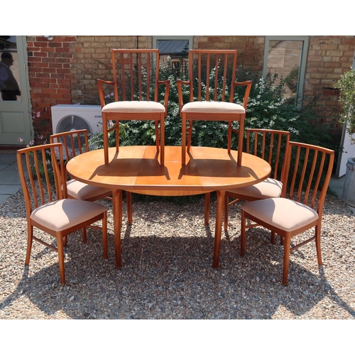 667 - A mid 20th century Mcintosh extendable dining table with six matching chairs 4+2 166cm long x 122cm ... 