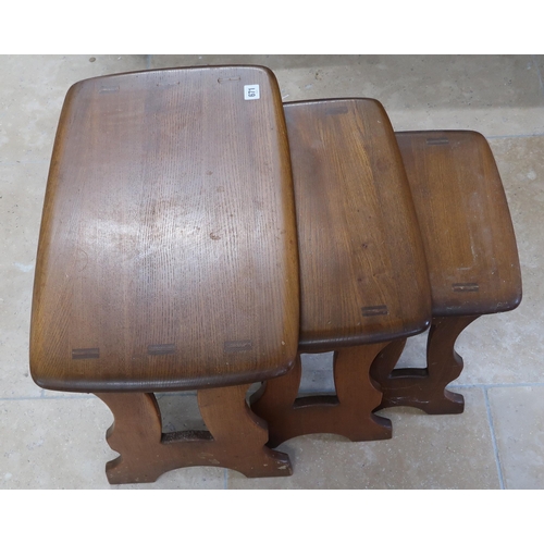 671 - Ercol Chantry solid Elm nest of three tables in dark finish. 57cm x 35cm x 42cm.