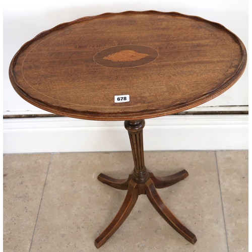 678 - A 19th Century side table with oval pie crust top, shell inlay to centre raised on single turned ped... 