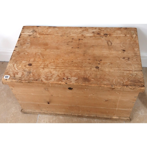 685 - A rustic pine lift top trunk with metal handles. 78cm x 47cm x 43cm high.