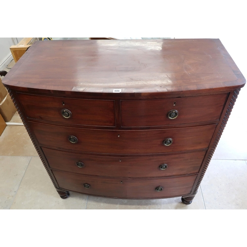 686 - An early Victorian mahogany bow front chest of two short over three long drawers, the top with cross... 