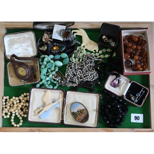 90 - An assortment of silver and costume jewellery. To include a butterfly wing pendant, a 'French jet' b... 