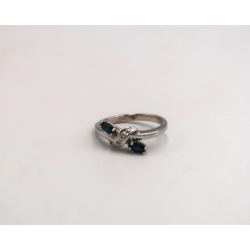 94 - A white gold marked 585 14ct dress ring, size L, with two sapphires to shoulders, approx 2.6 grams