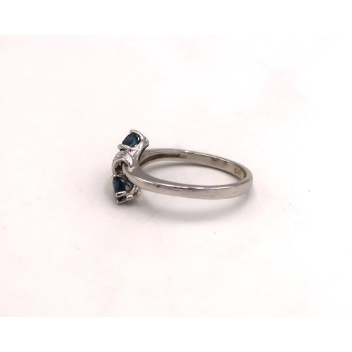 94 - A white gold marked 585 14ct dress ring, size L, with two sapphires to shoulders, approx 2.6 grams