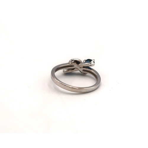 94 - A white gold marked 585 14ct dress ring, size L, with two sapphires to shoulders, approx 2.6 grams