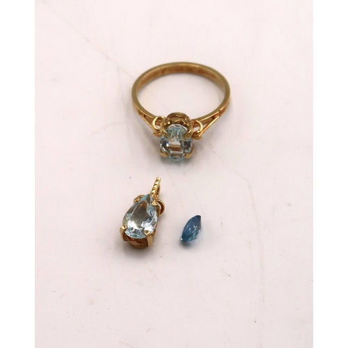 97 - A stamped 750 yellow gold dress ring with aquamarine to shoulder with an unmarked yellow metal penda... 