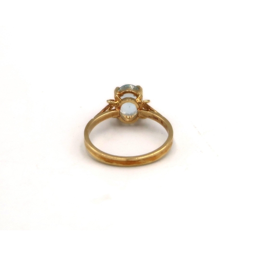 97 - A stamped 750 yellow gold dress ring with aquamarine to shoulder with an unmarked yellow metal penda... 