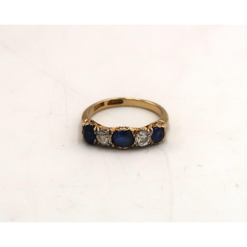 98 - An 18ct stamped yellow gold dress ring with two diamonds and three sapphires to shoulder, size M, ap... 