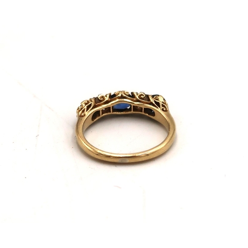 98 - An 18ct stamped yellow gold dress ring with two diamonds and three sapphires to shoulder, size M, ap... 