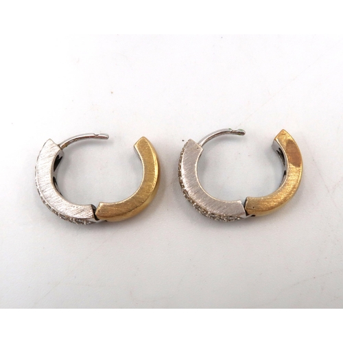 194 - A pair of 18k (tested) yellow and white gold diamond hoop earrings - total diamond weight approx 0.8... 