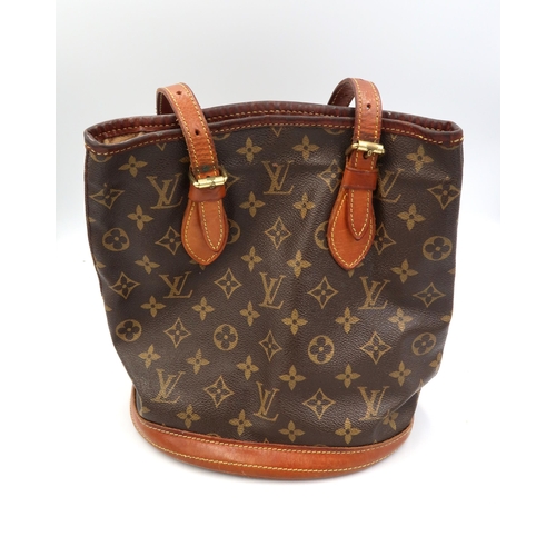 482A - A Louis Vuitton bucket bag - Petit Bucket - Monogram Canvas series with gold-tone hardware and adjus... 