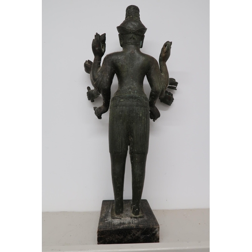 491 - An antique Khmer style standing bronze bayou style Lukeshvara statue, 58cm high, on plinth base