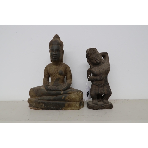 493 - A South East Asian stone seated Buddha and a stoneware figure of a deity