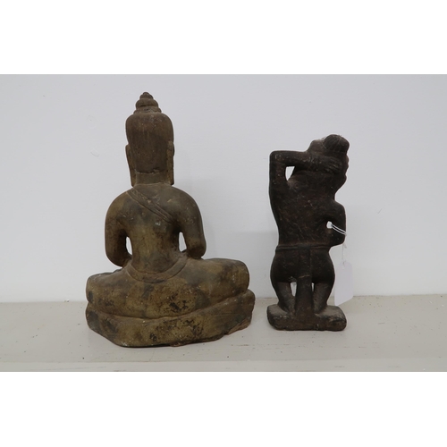 493 - A South East Asian stone seated Buddha and a stoneware figure of a deity