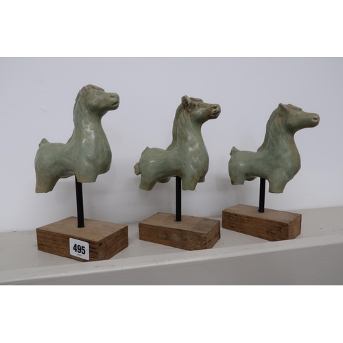 495 - Three soapstone carved statuette of horses, South East Asian origin, on pedestals with plinths below