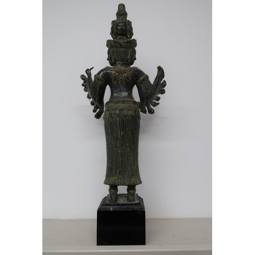 499 - An antique deity statue, Khmer style Bayon Prajuaparamita goddess, on plinth, 65cm high