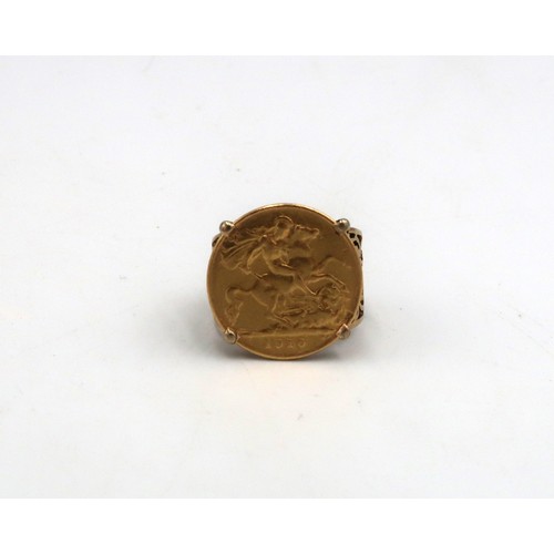 201 - A 1910 half sovereign in a 9ct gold ring mount - total weight approx 7.9 grams