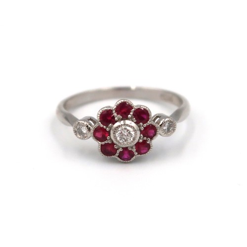 176 - A good quality platinum ruby and diamond ring retailed by Luke Stockley of London - head size approx... 