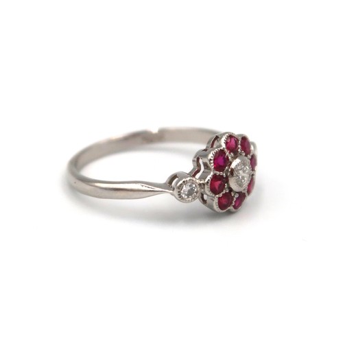 176 - A good quality platinum ruby and diamond ring retailed by Luke Stockley of London - head size approx... 