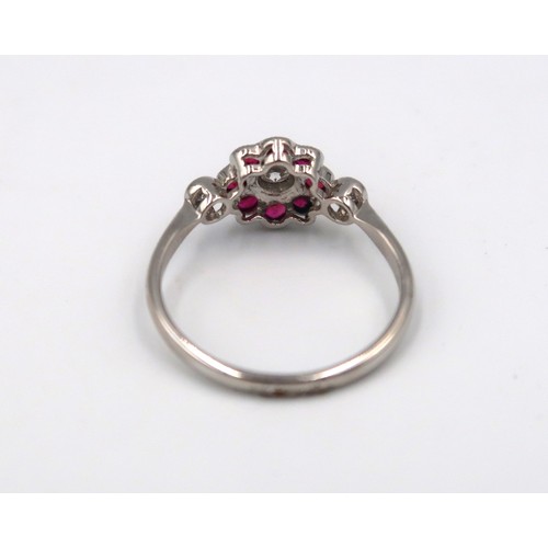 176 - A good quality platinum ruby and diamond ring retailed by Luke Stockley of London - head size approx... 