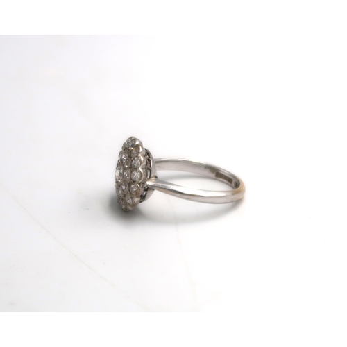 10 - An old cut diamond circular double cluster ring. Estimated total diamond weight 1ct. Estimated G/H c... 