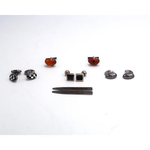 102 - Five sets of silver cufflinks including H.M. Millennium example, Jet and amber etc, all in good cond... 