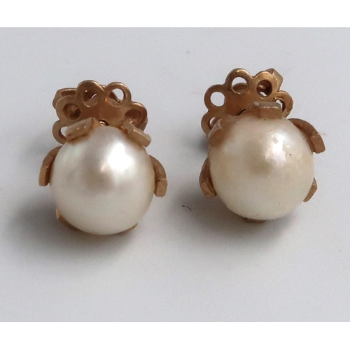 109 - A pair cultured pearl ear studs. Stamped 15ct. Weight 3.11 grams.