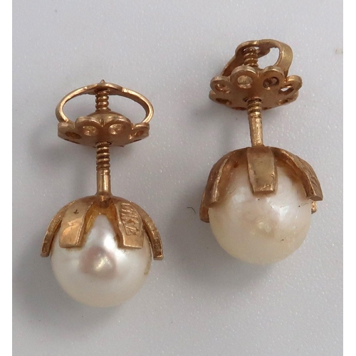 109 - A pair cultured pearl ear studs. Stamped 15ct. Weight 3.11 grams.