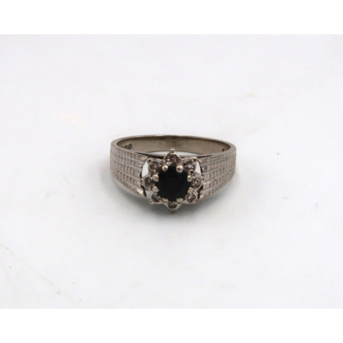 12 - A 9ct white gold dress ring - sapphire to shoulder with eight small diamonds - approx weight 3.6 gra... 