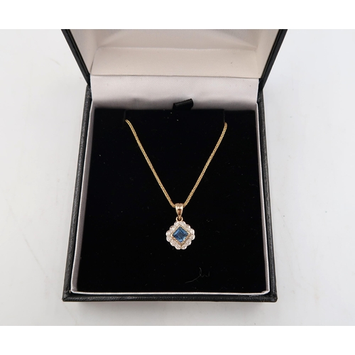 121 - A 9ct yellow gold sapphire and diamond pendant on a 9ct gold chain - head size approx 10mm x 10mm - ... 