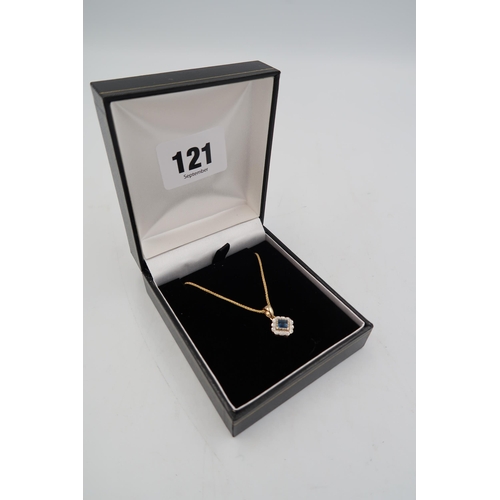 121 - A 9ct yellow gold sapphire and diamond pendant on a 9ct gold chain - head size approx 10mm x 10mm - ... 