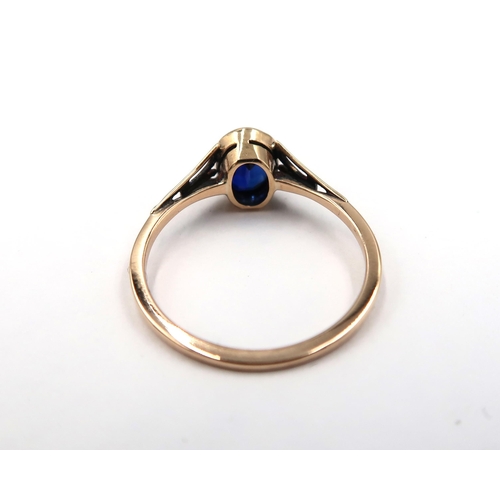 123 - A 9ct yellow gold Arts and Crafts sapphire ring - sapphire is a good colour - head size approx 7mm x... 