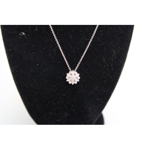 124 - A good quality 18ct white gold diamond cluster pendant on an 18ct white gold chain - retailed by Luk... 