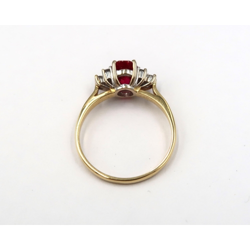 125 - An 18ct yellow gold red tourmaline (rubellite) and diamond ring - the rubellite is a good colour, di... 