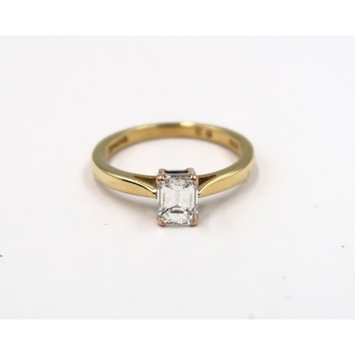 127 - A good quality 18ct yellow gold emerald cut diamond ring - diamond is approx 0.63ct, the diamond wei... 