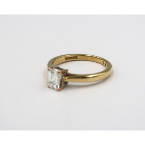 127 - A good quality 18ct yellow gold emerald cut diamond ring - diamond is approx 0.63ct, the diamond wei... 