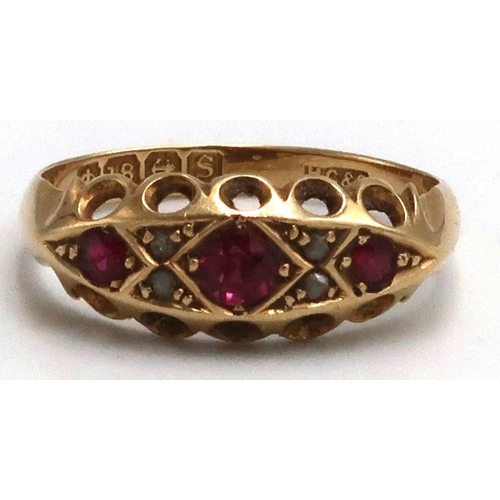 13 - An 18ct yellow gold dress ring  with three rubies and four small diamonds, ring size K, approx 2.2 g... 