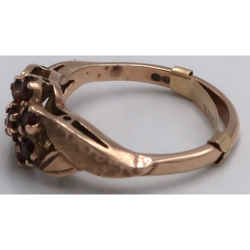 15 - A 9ct marked yellow gold garnet cluster ring, Size O 3.4grams.