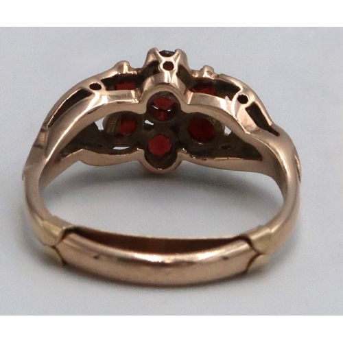 15 - A 9ct marked yellow gold garnet cluster ring, Size O 3.4grams.