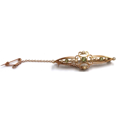 17 - A marked 15ct yellow gold peridot and seed pearl bar brooch, in good condition, approx 3.8 grams