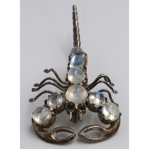 18 - A white metal brooch in the form of a Scorpion, moonstones to spine, approx. 6cm long, overall good ... 