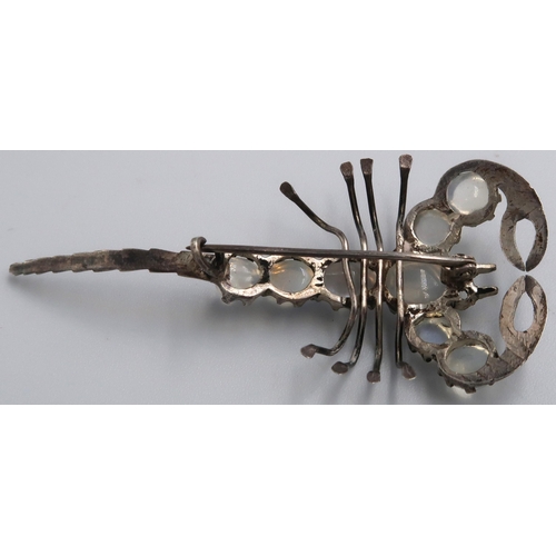 18 - A white metal brooch in the form of a Scorpion, moonstones to spine, approx. 6cm long, overall good ... 