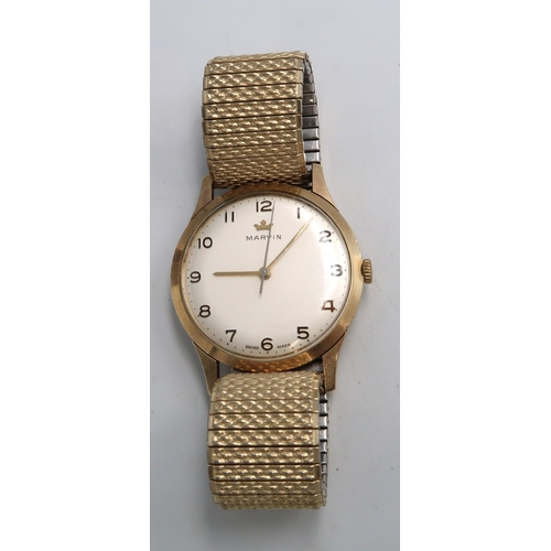 253 - A Gents Marvin 9ct H.M. Yellow gold cased wristwatch on gold plated bracelet strap. No 01987 3.3cm a... 